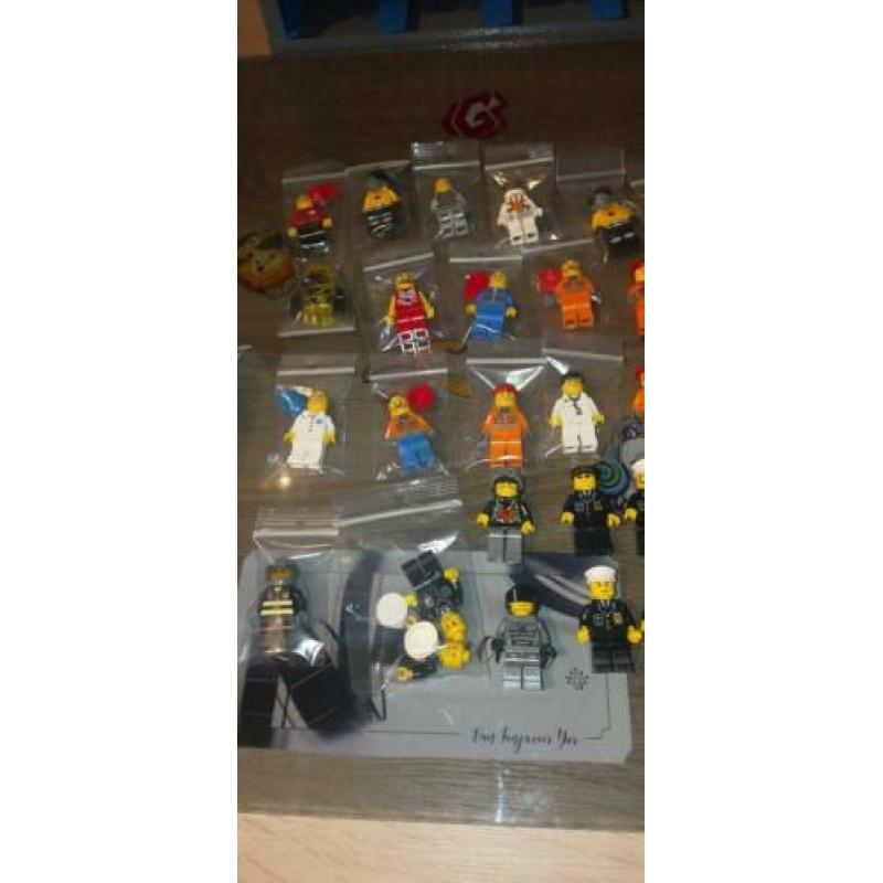 Lego 69 minifigures (City, Space, Ferrari, Racers, Miners)